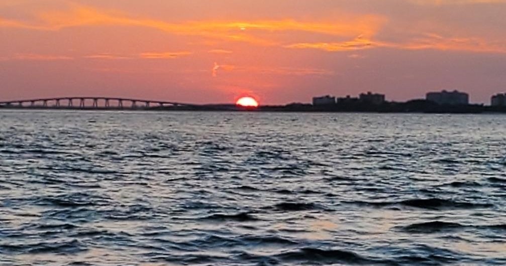 a sunset over a body of water