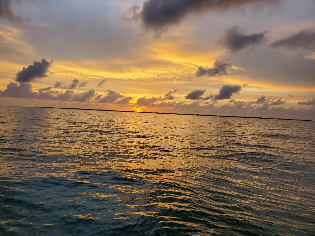 a sunset over a body of water